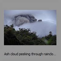 Ash cloud peeking through rainclouds